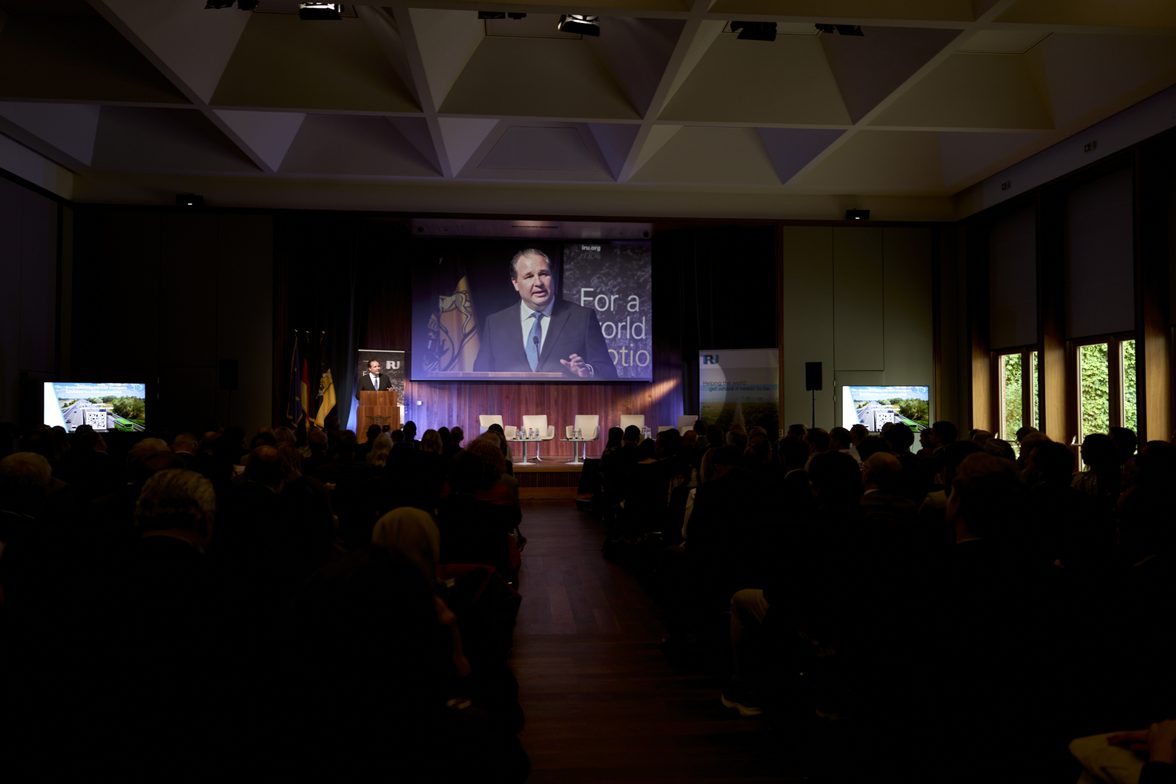 Put photos here in carousel sent via Webex     Driving the decarbonisation debate     Throughout 2025, IRU ensured that the transition to low- and zero-emission road transport remained grounded in operational reality.   A highlight was IRU’s EU decarbonisation flagship event, held in Brussels with the participation of the Belgian Minister for Mobility, EU policymakers, industry leaders and operators. The event focused on realistic decarbonisation pathways, fleet diversity and the importance of enabling cond