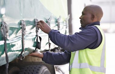 man sealing truck