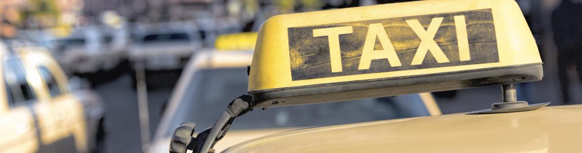 taxi_sign_on_roof_of_cab