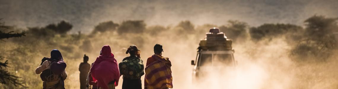 African women on a dusty road