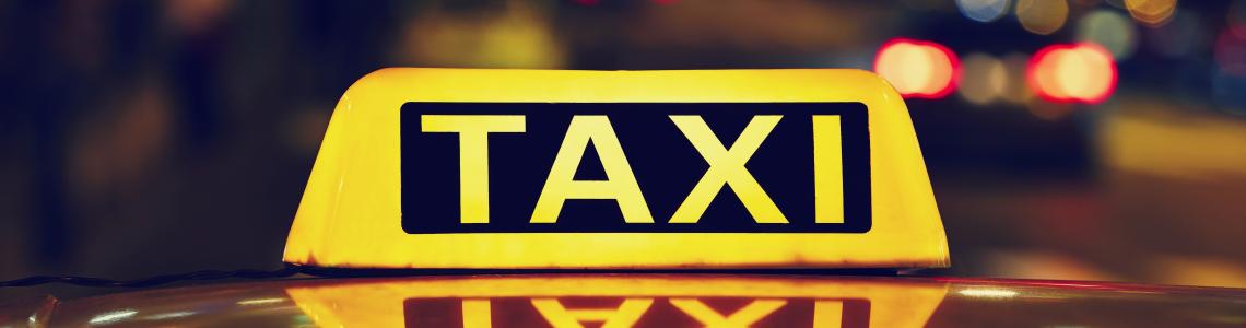 Taxi car on the street at night