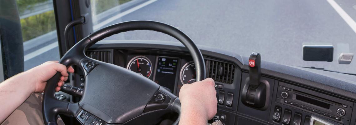 driver_driving_its truck_on_a_highway