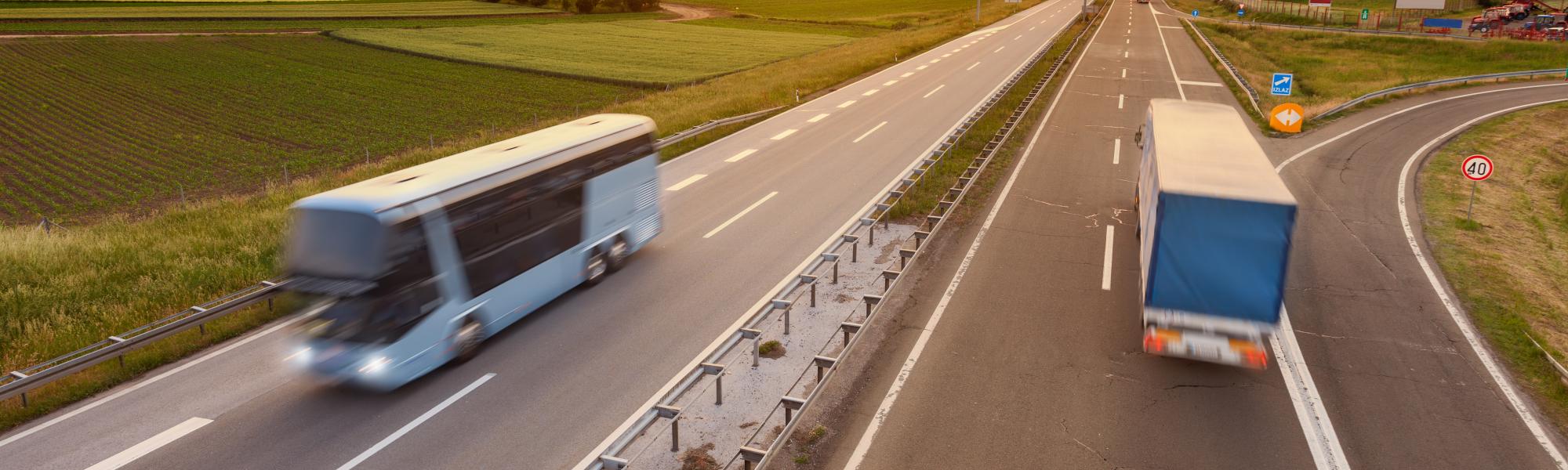 coach on a road with sunset