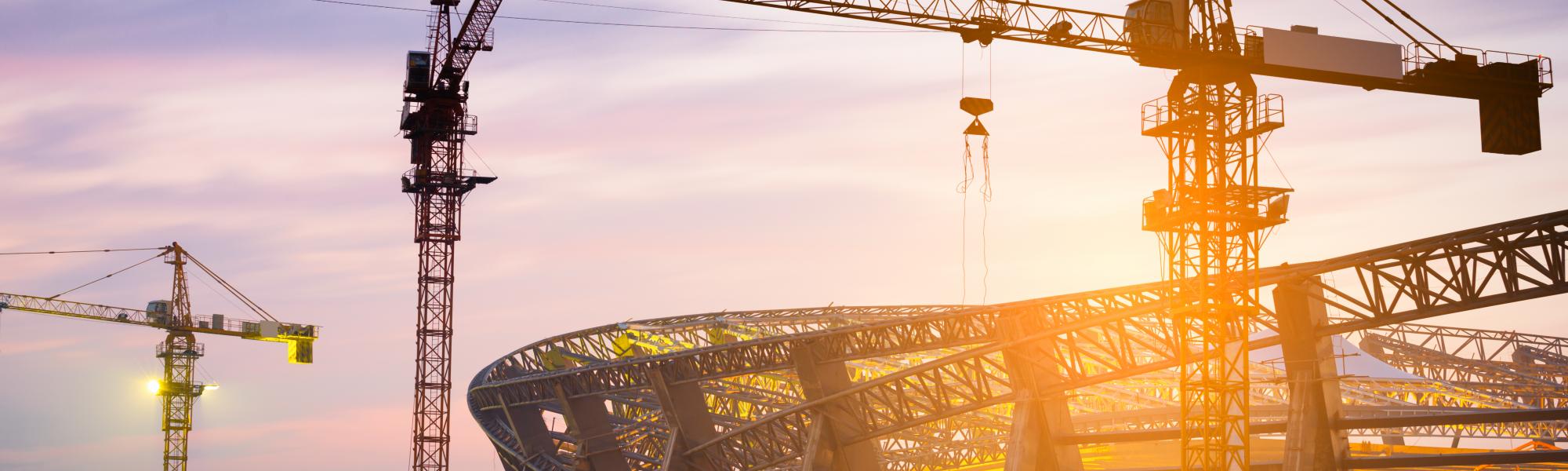 cranes, sunset, stadium