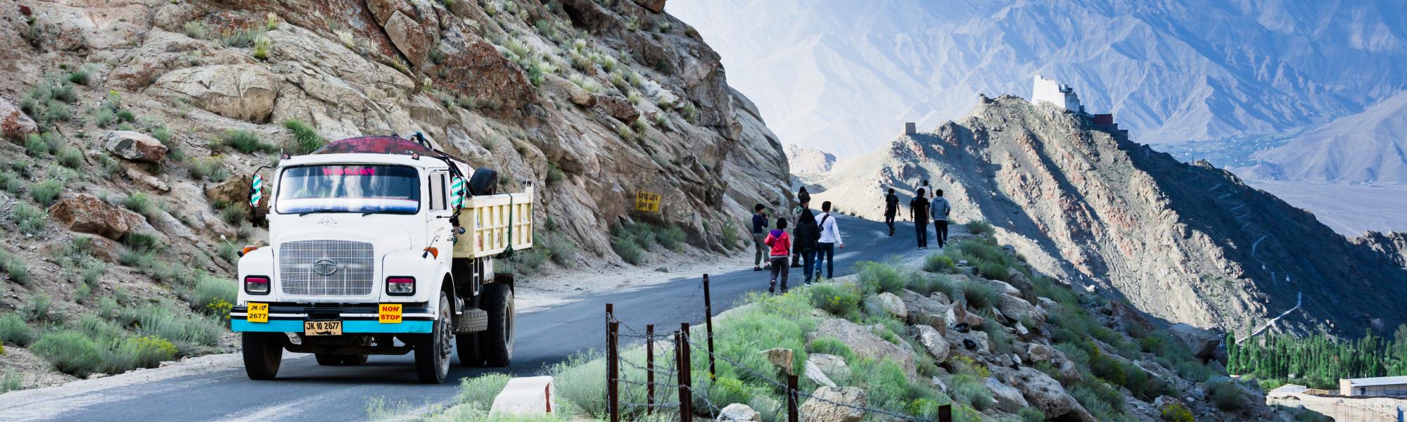 mountain road truck and people