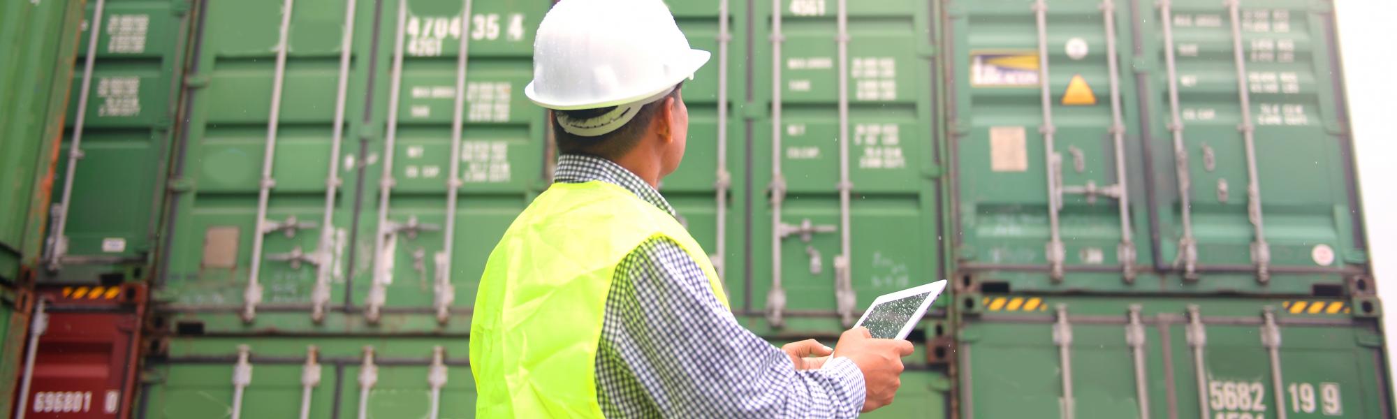 man using tablet for logistics data