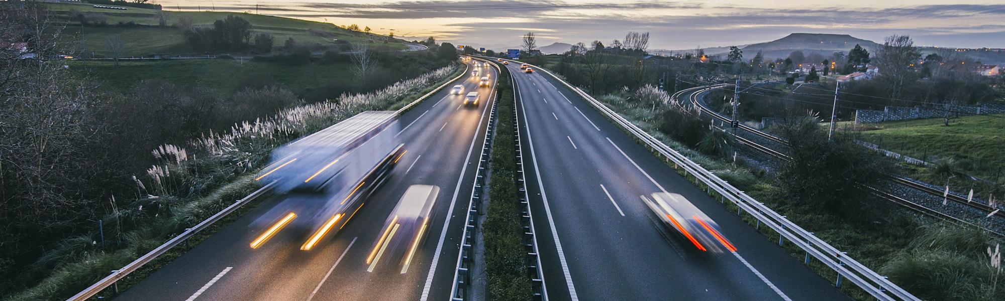 Vehicles driving at dusk