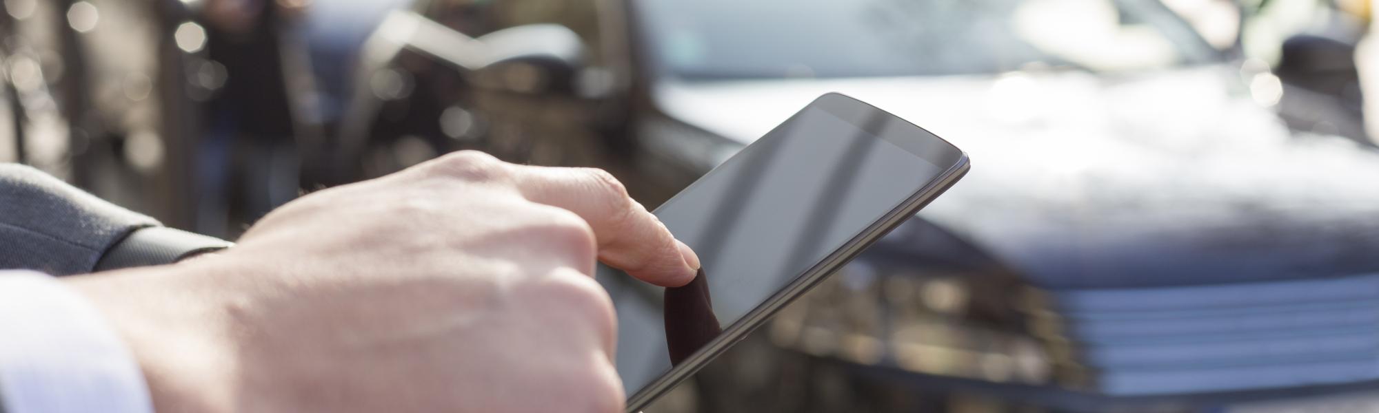 Man using a mobile phone to order a taxi