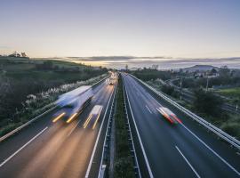 trucks speeding at dusk